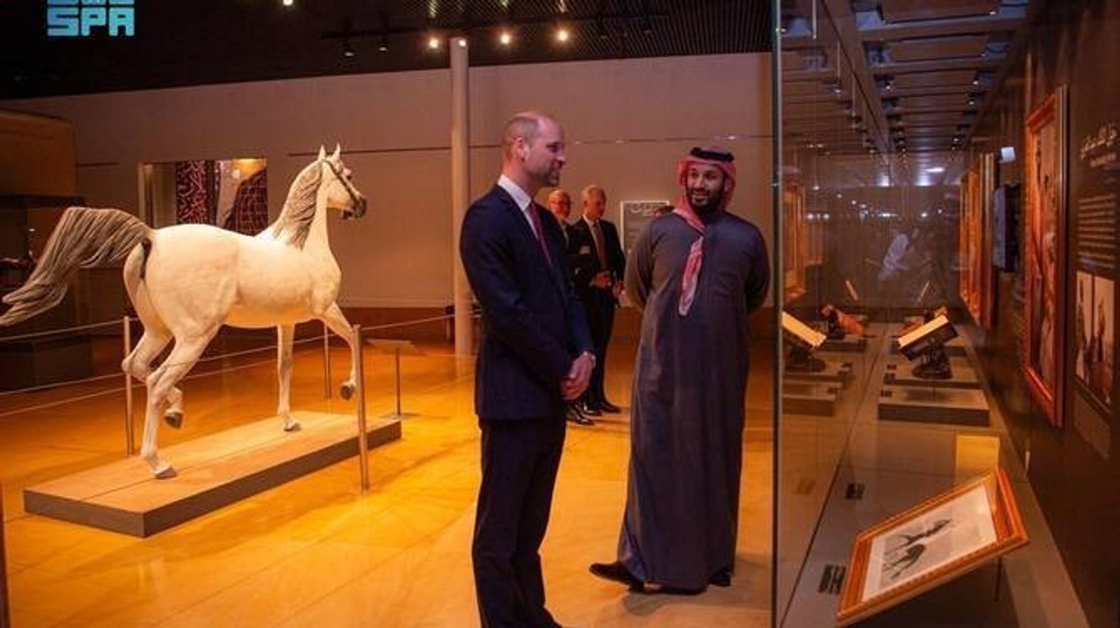 Saudi Arabia Crown Prince Mohammad bin Salman and Britain’s Prince William in a museum admiring exhibits, including a white horse sculpture.