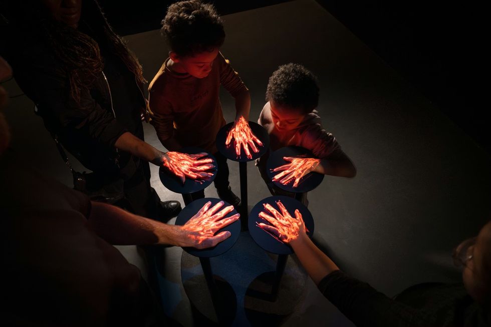 Science Museum Group - YOU:MATTER. People interacting with a physical augmented reality interface offering a window into the human vascular system