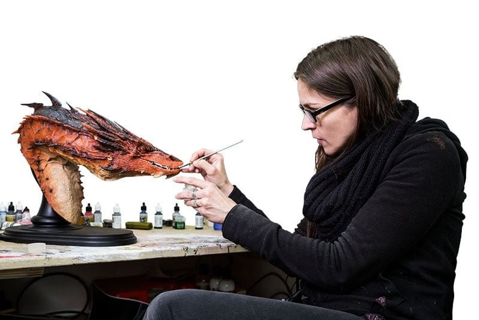 sculpting a model dragon at weta workshop in NZ