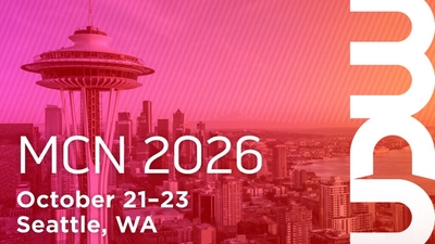 Seattle skyline with MCN 2026 event details, October 21-23.