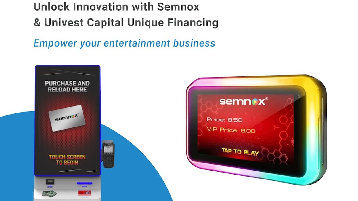 Semnox payment kiosk and card reader with vibrant display for entertainment businesses.