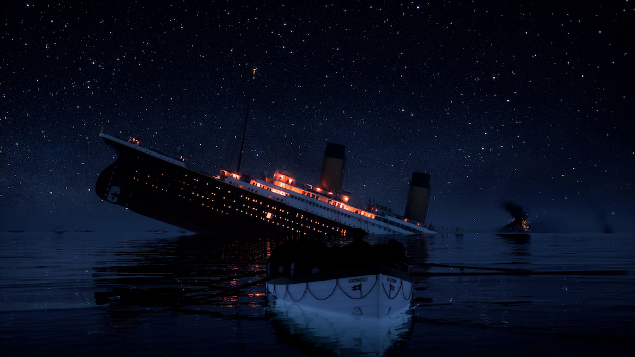Ship sinking under starry sky with lifeboat in foreground.
