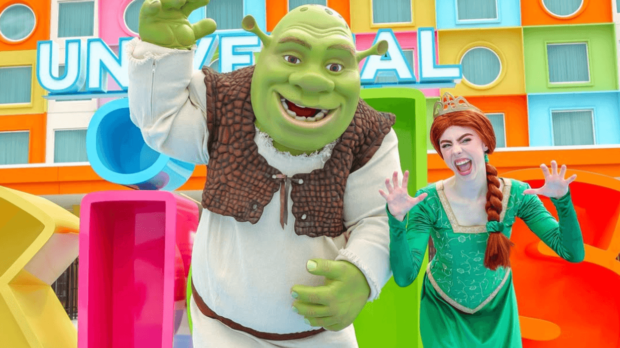 Shrek and Fiona costumed characters posing joyfully at Universal Kids Resort in Texas