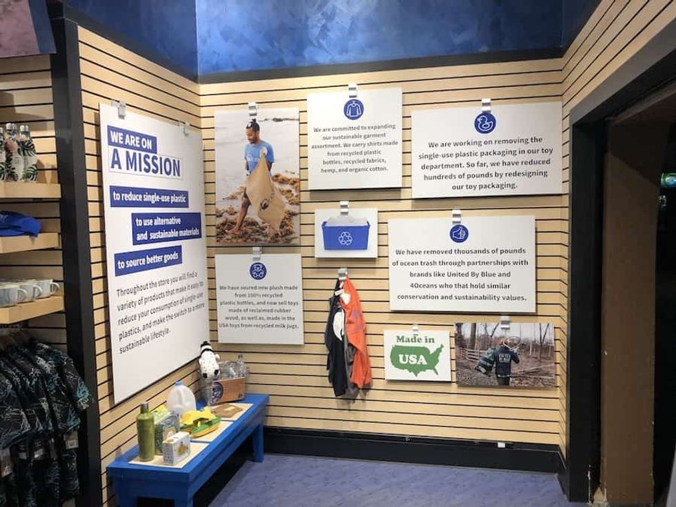sign in a retail store by Event Network promoting sustainability
