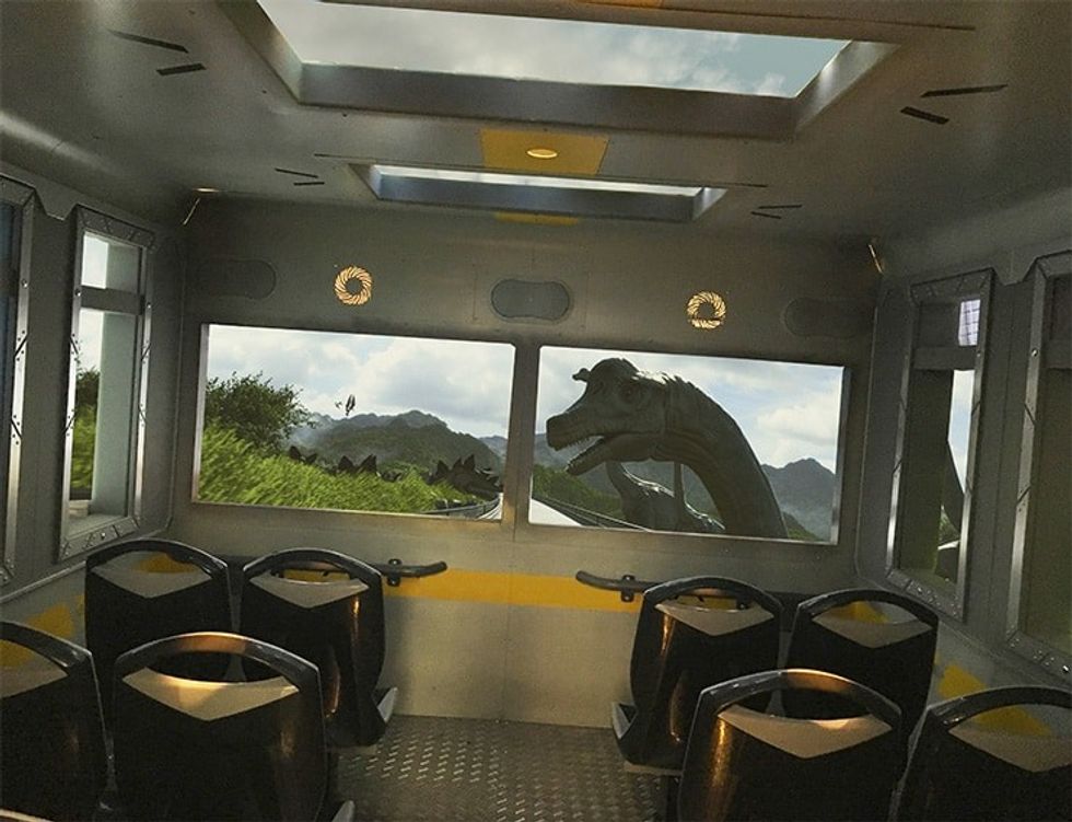 Simworx's Immerisve Adventurer Dinosaur theme with lush green view and dinosaur out windows