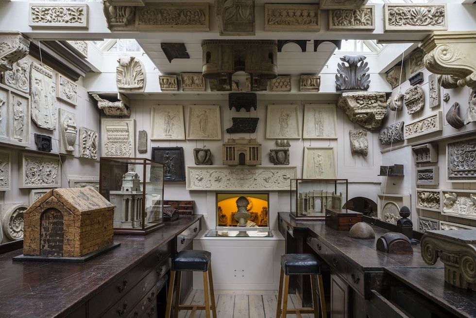 Sir John Soane's Drawing Office - Room filled with architectural models, reliefs, and sculptures on walls and tables.