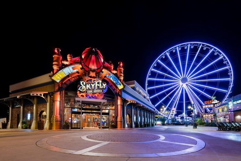 SkyFly attraction at night