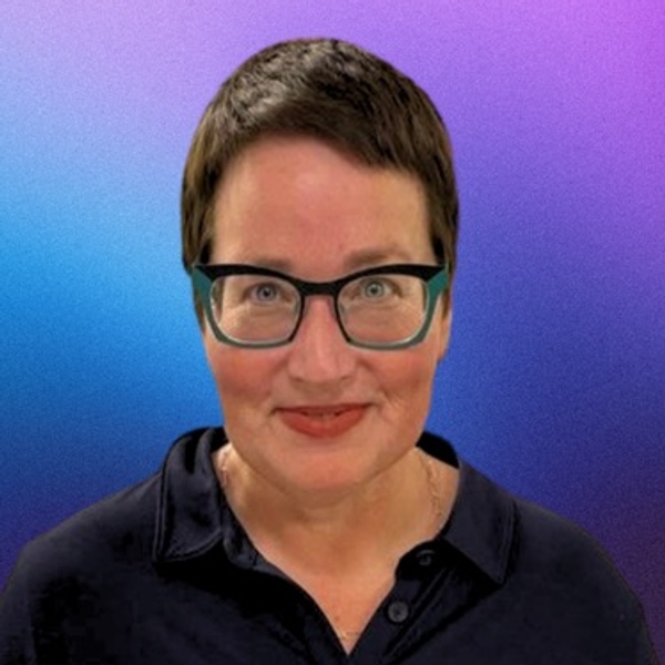 Smiling person with short hair, glasses, against a vibrant gradient background.