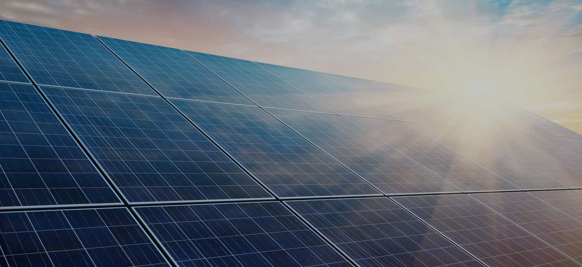 Solar power plant at sunset