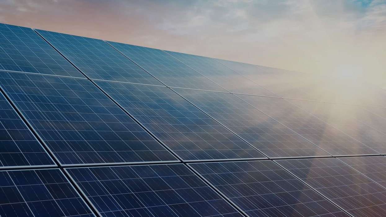 Solar power plant at sunset