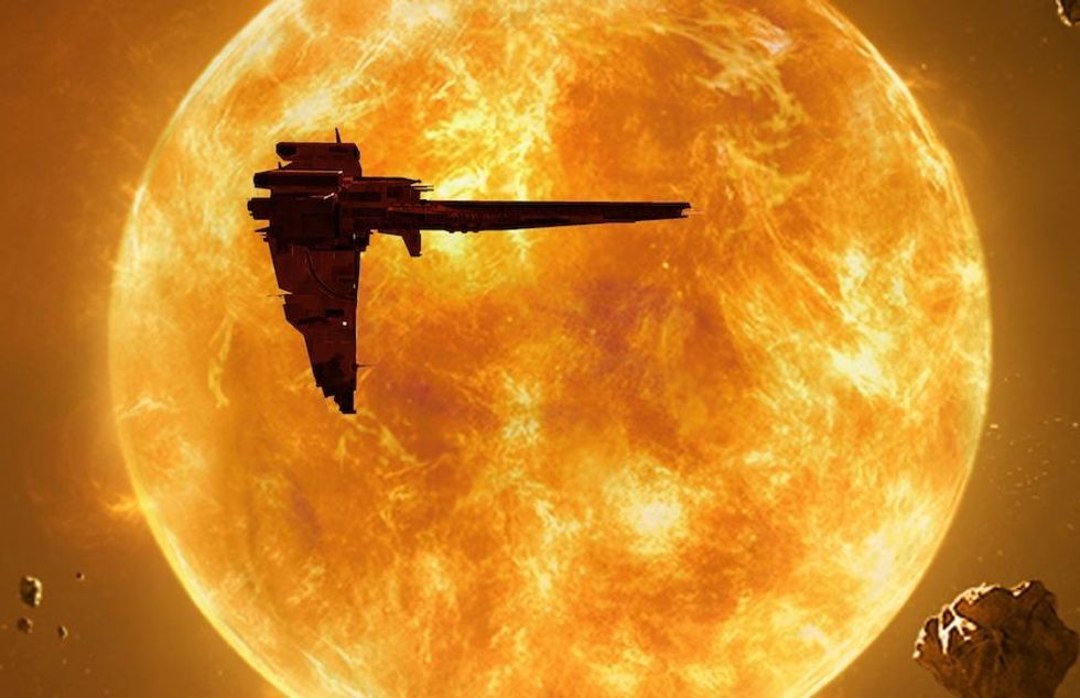 spaceship silhouetted against the orange sun