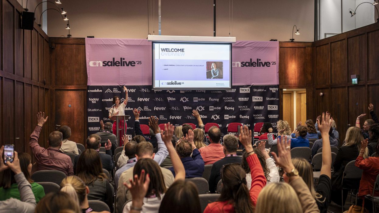 Speaker engaging audience with raised hands at a conference, at "On Sale Live 25"