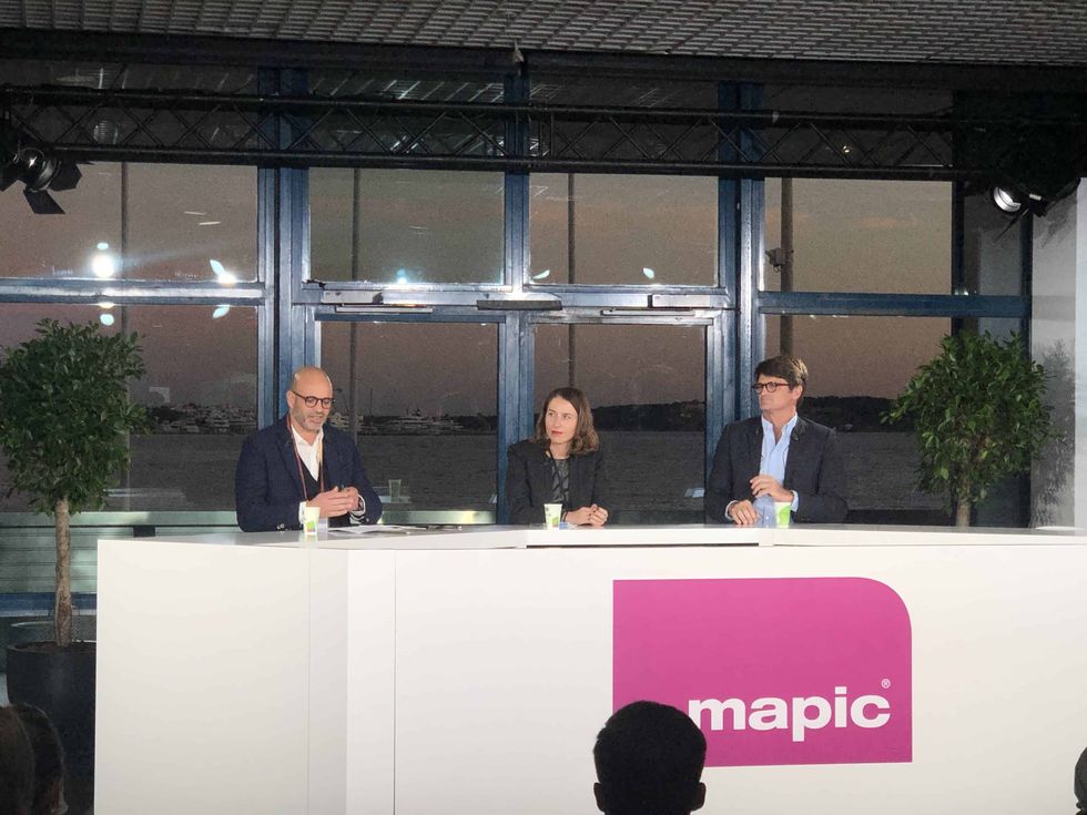 speakers at a desk at MAPIC