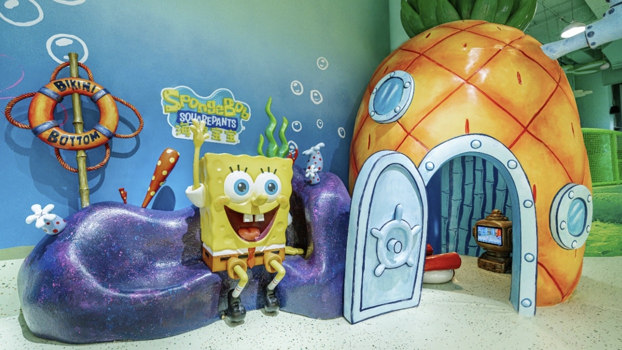 SpongeBob figure sits beside a model of his pineapple house in a colourful Bikini Bottom display at Nickelodeon Playtime 2.0