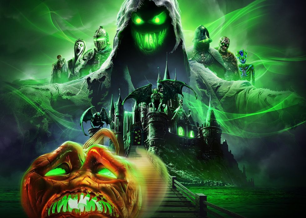 Spooky, glowing figures and a castle shrouded in green mist with a demonic pumpkin face, Universal Studios Singapore