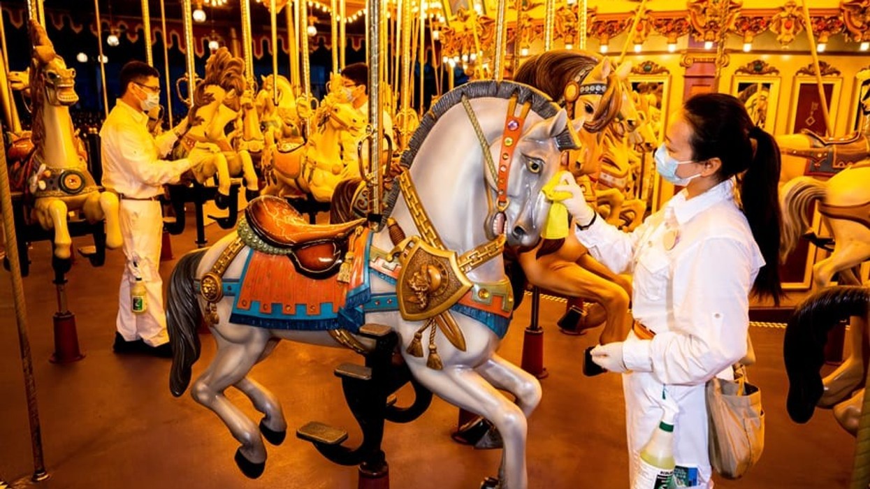 Staff cleaning carousel at Hong Kong Disneyland