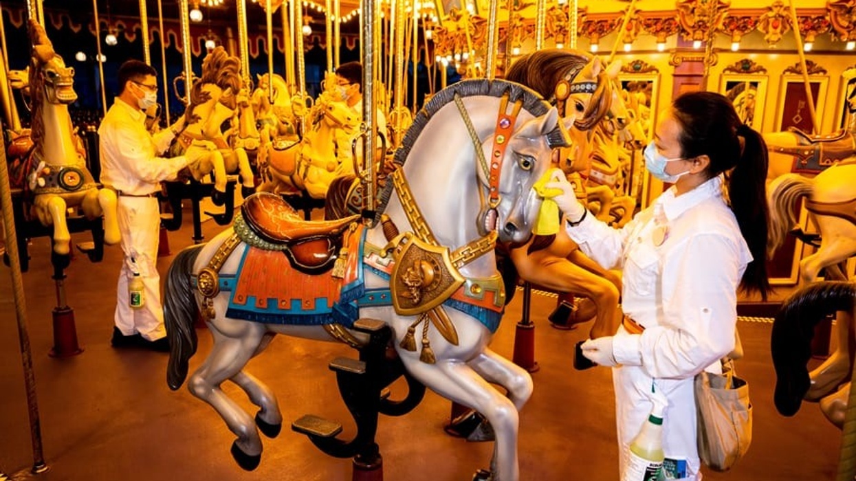 Staff cleaning carousel at Hong Kong Disneyland