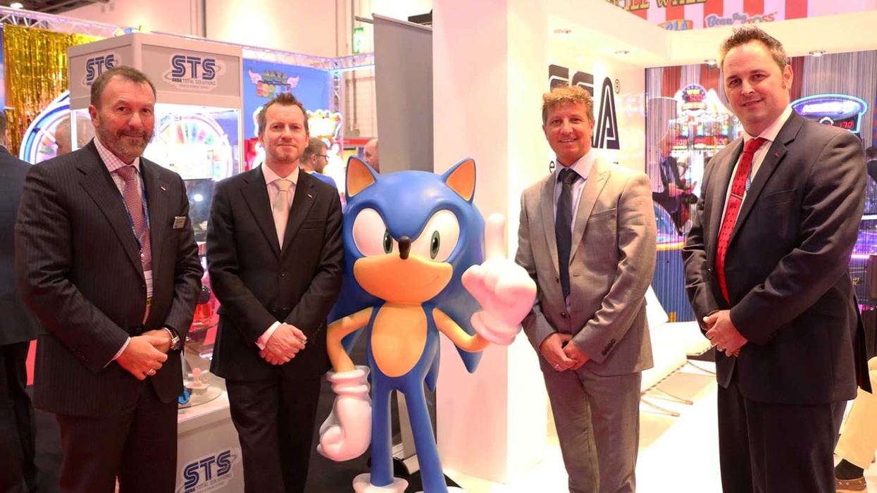 staff from sega and superbowl uk next to sonic the hedgehog