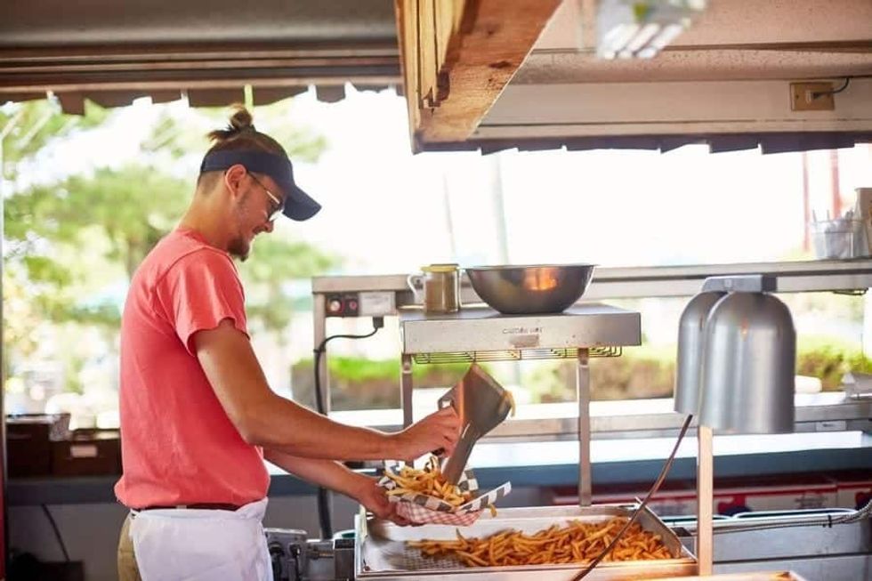 Staff preparing fries at Morey's Piers Grab and Go