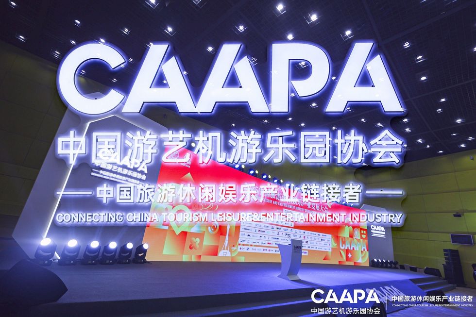Stage with "CAAPA" and Chinese characters, promoting tourism and entertainment.