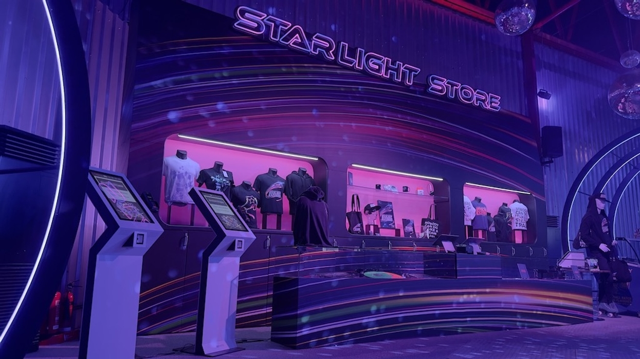 Starlight Express show store interior with neon lights and merchandise on display.