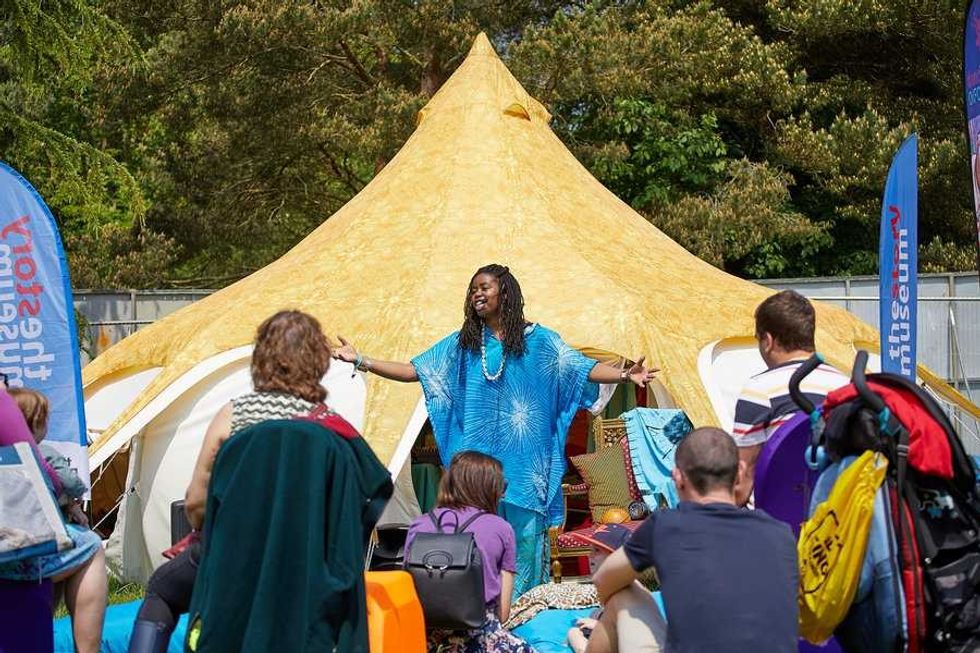 Storyteller in front of the storytelling pumpkin tent at The Story Museum