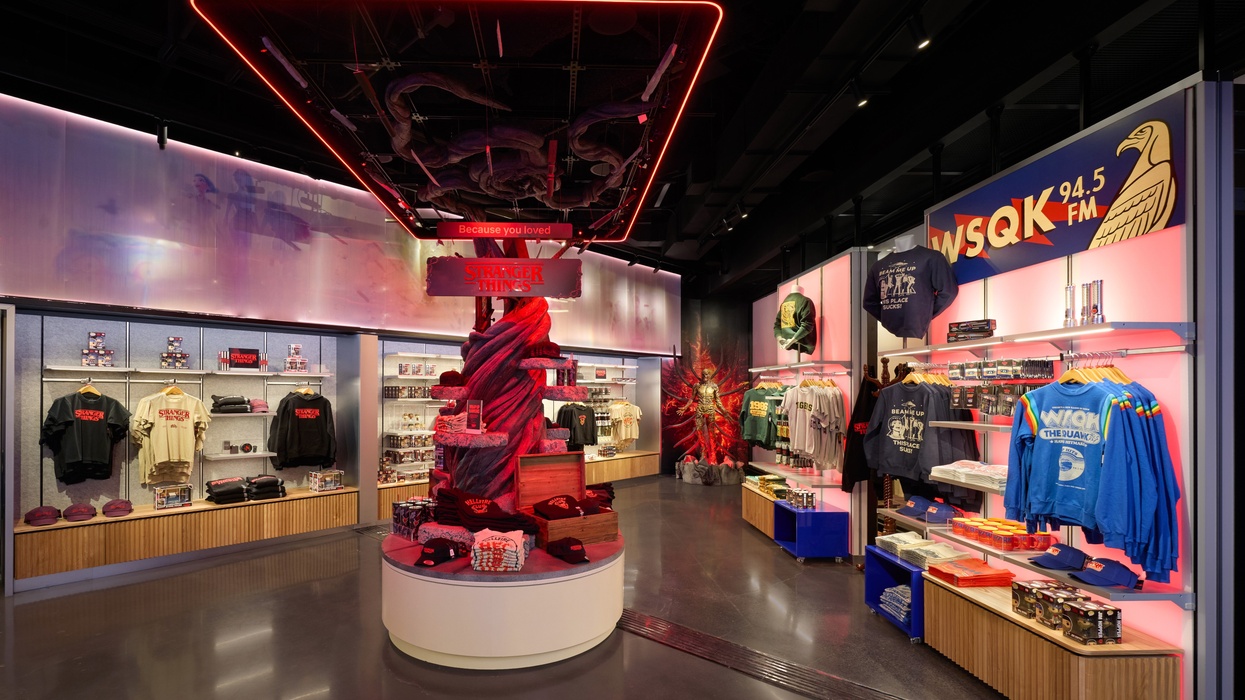 Stranger Things-themed store with merchandise and neon lights.