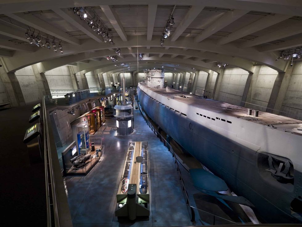 Submarine exhibit in a large, modern museum hall at Griffin Museum of Science and Industry with various displays.