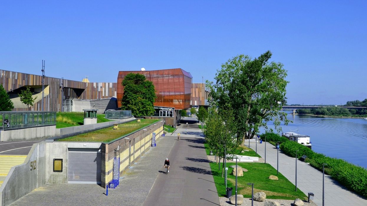 Summer at the Vistula Boulevards promenade on the west side of the Vistula river. Popular place for weekend walks. View from Swietokrzyski bridge. Warsaw, Poland
