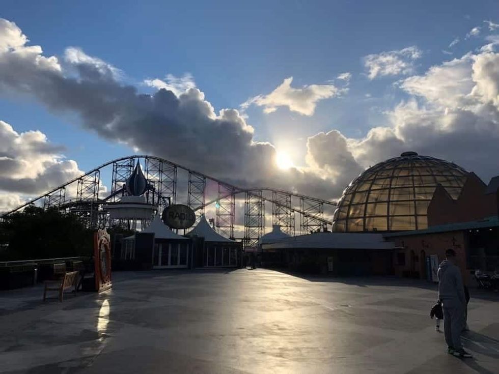 Sun peeking out behind clouds at Blackpool Pleasure Beach