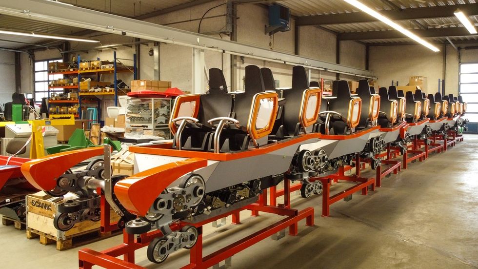 Sunkid roller coaster vehicle in a warehouse.