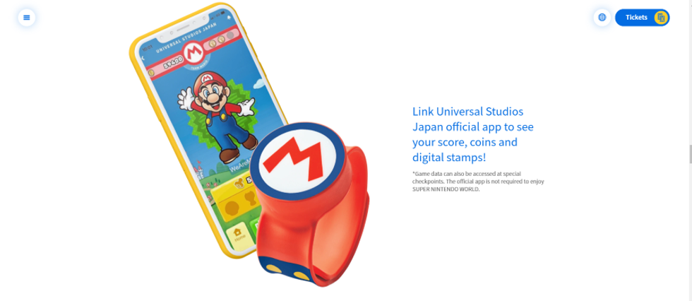 Super Nintendo World power up band next to mobile app