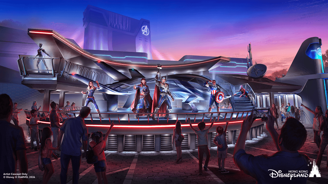 Superheroes on stage at a futuristic theme park attraction during sunset at Hong Kong Disneyland