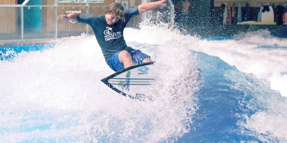 surfer rides wave at offshore surf surf parks