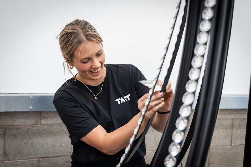 TAIT team member creating Swarovski-clad crystal chandeliers for MSC World Europa