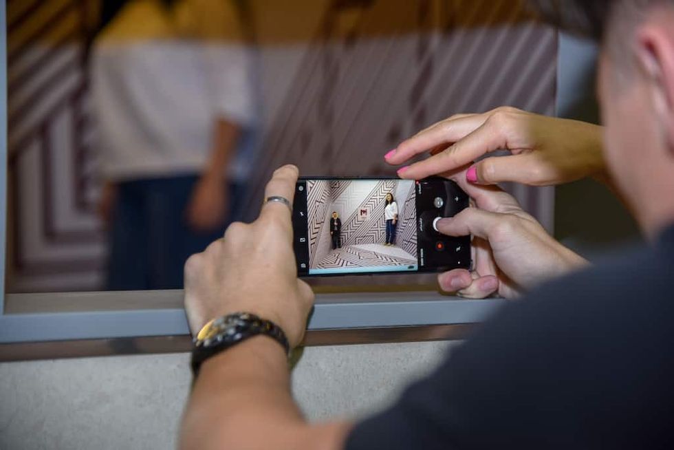 taking photos at the museum of illusions