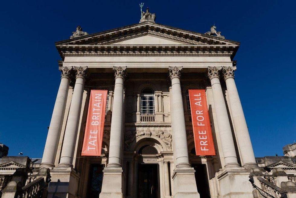 Tate Britain entrance with large columns and banners, "Free for All."
