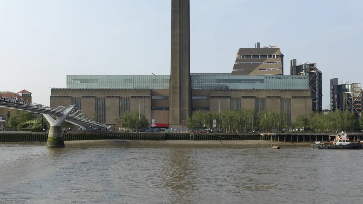 Tate Modern and Millennium Bridge over the River Thames, London, on a clear day.
