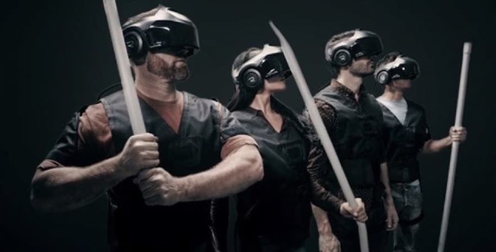 team playing VR game with props