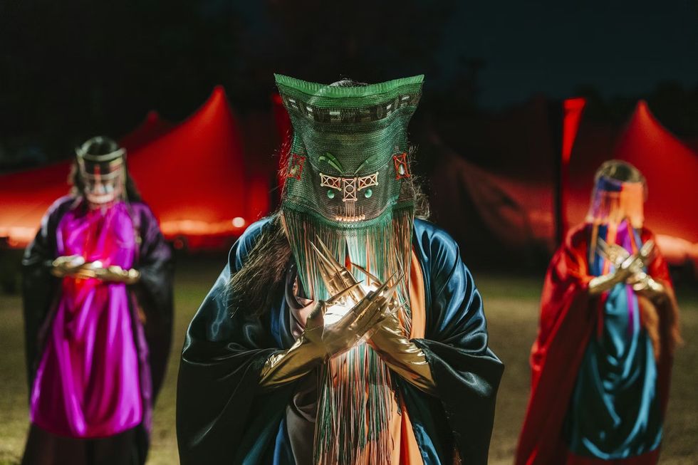 The Cort\u00e8ge: A Festive Funeral for Our Times masked performers