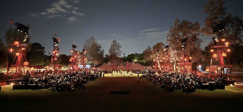 The Cort\u00e8ge: A Festive Funeral for Our Times tent at dusk