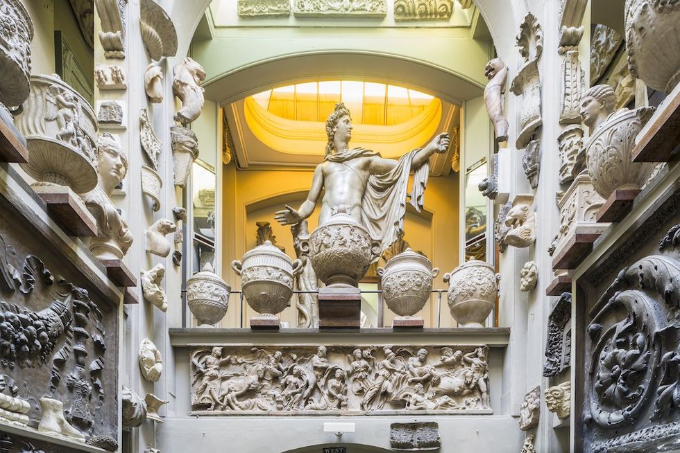 The Dome, at Sir John Soane's Museum - Classical statue surrounded by ornate sculptures and vases in a sunlit gallery.