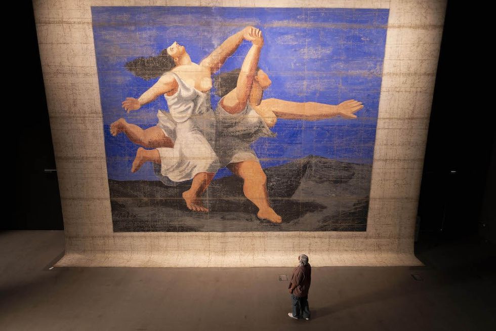The largest Picasso work in the world,the 1924 front stage cloth for the BalletsRusses’ production, Le Train Bleu, atV&A East Storehouse. Image by DavidParry/PA Media Assignments. PabloPicasso, Le Train Bleu front stage cloth,1924 © The estate of Pablo Picasso