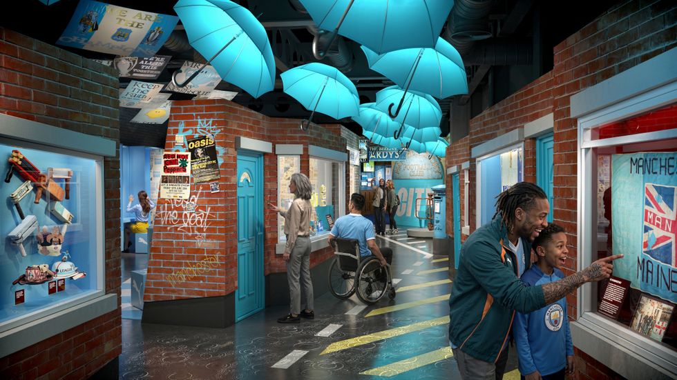 The Manchester City Museum Experience exhibit with colorful umbrellas, people, and vibrant displays on brick walls.