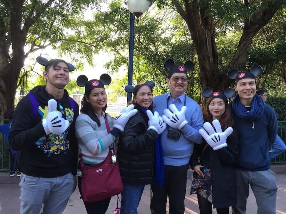 The Mario family enjoys a busman's holiday at Hong Kong Disneyland. Left to right_ Raymond, Anna, Cynthia, Mario, Bea and Nico.
