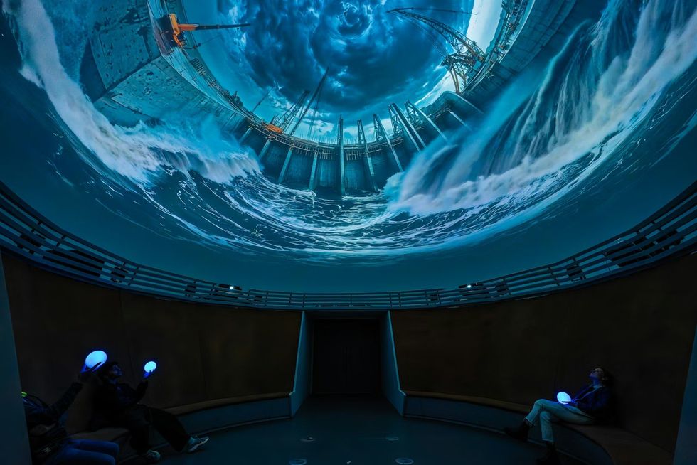 The Netherlands Pavilion at Expo 2025 Immersive dome theater with stormy ocean projection and seated viewers.