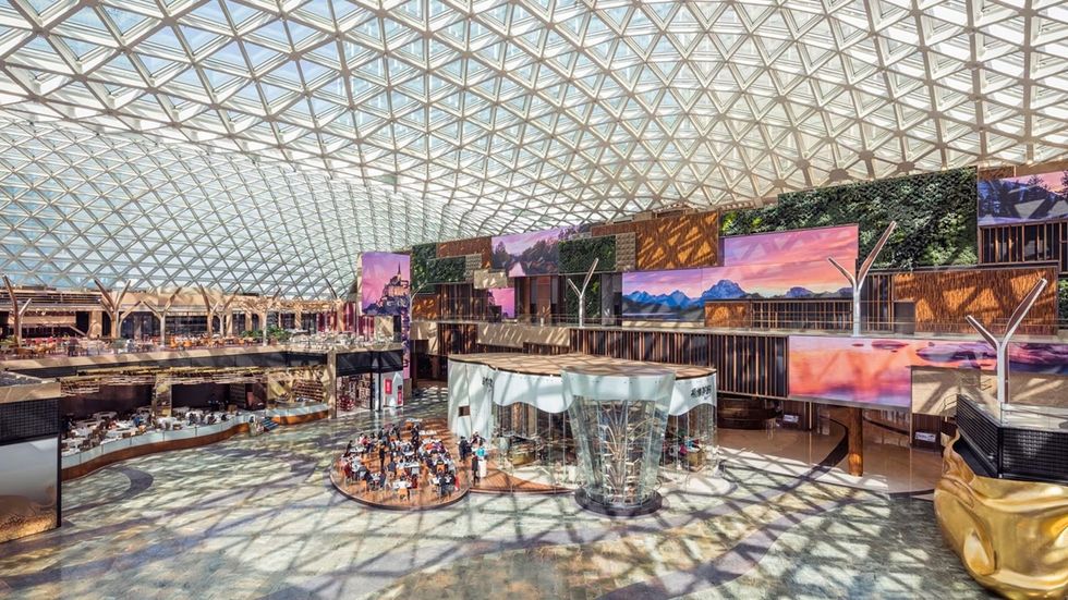 The Spectacle at MGM Cotai with a record-breaking geometric glass roof and vibrant digital displays.
