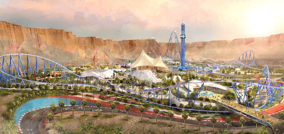 Theme park with roller coasters, tower ride, and desert landscape.