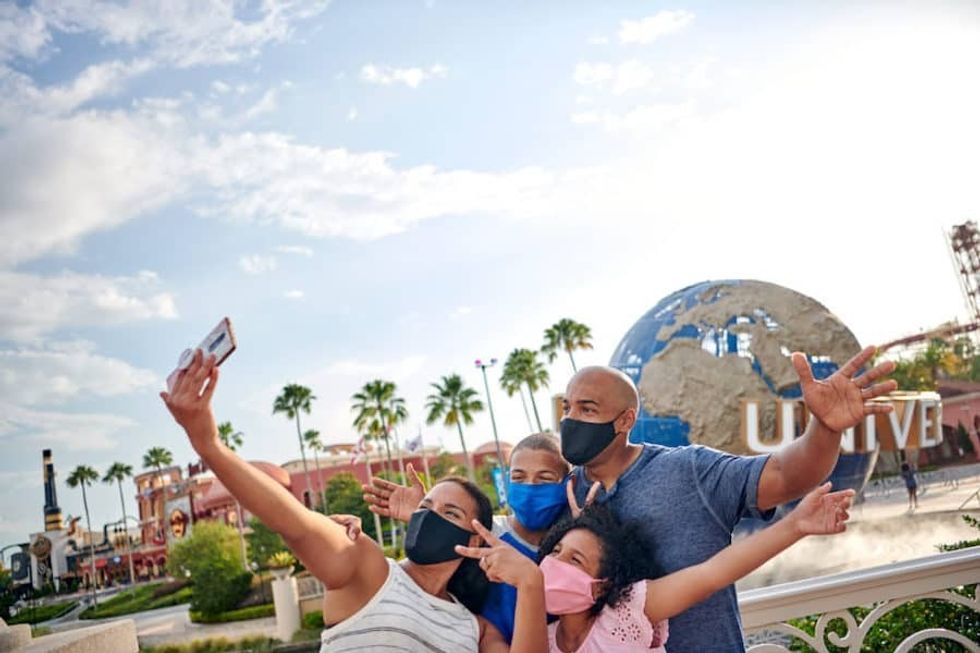 theme parks coronavirus family at Universal Orlando in masks