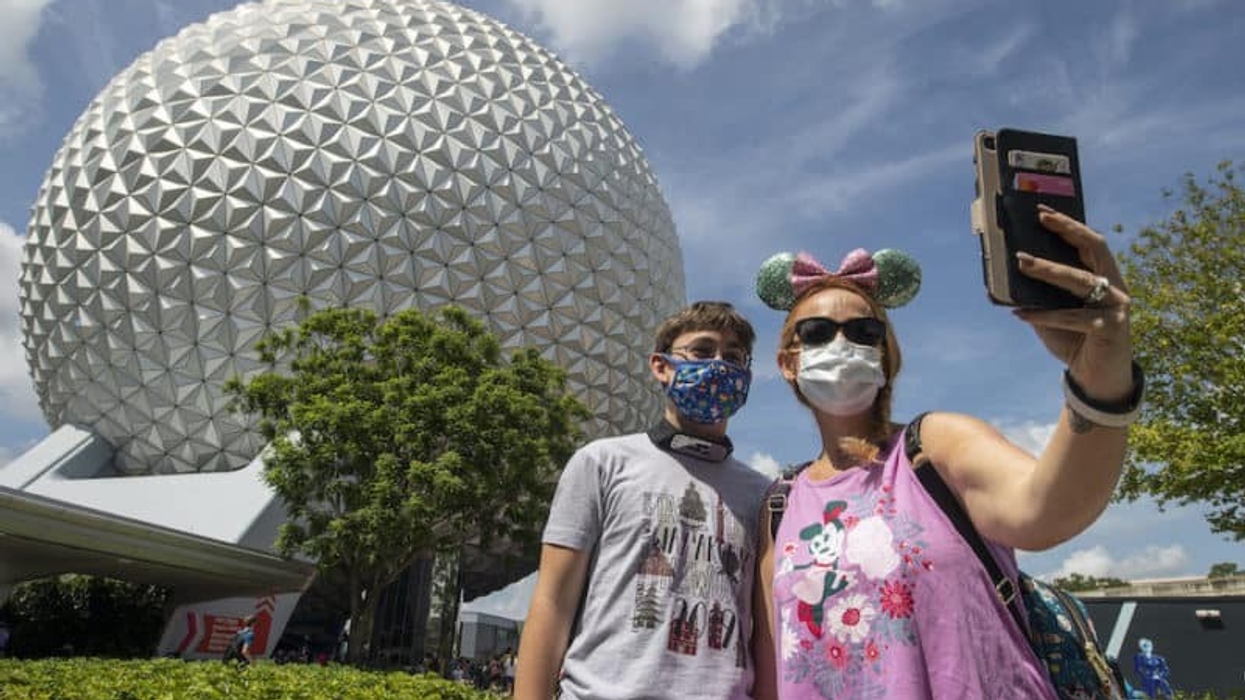 theme parks coronavirus guests wearing masks at Epcot Disney